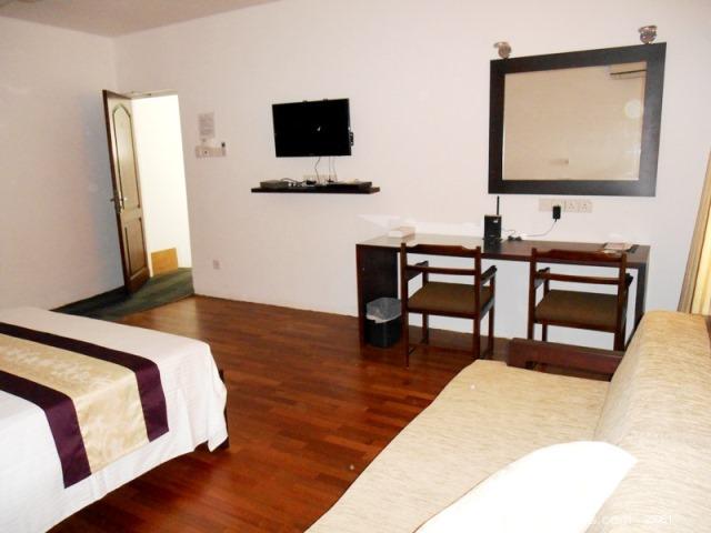 Spacious bedroom with sofa 